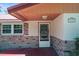 Charming front entrance with brick accents, manicured landscaping, and a decorative front door at 7095 South St, Webster, FL 33597