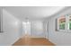 Spacious living area with bright walls, light wood floors, and ample natural light at 7095 South St, Webster, FL 33597