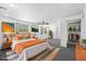 Spacious main bedroom featuring a ceiling fan, multiple windows, and ample closet space at 7095 South St, Webster, FL 33597