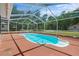 Screened-in pool with patio area is great for outdoor fun at 7095 South St, Webster, FL 33597