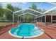 Screened-in pool area offers outdoor enjoyment and relaxation at 7095 South St, Webster, FL 33597