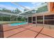 Enclosed patio area with a private pool, perfect for outdoor relaxation and entertaining at 7095 South St, Webster, FL 33597