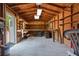 Spacious workshop with ample shelving, a workbench, and a concrete floor at 7095 South St, Webster, FL 33597