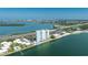 Breathtaking aerial view of a waterfront condo community, featuring stunning ocean views and lush landscaping at 7200 Sunshine Skyway S Ln # 4B, St Petersburg, FL 33711