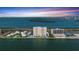 Breathtaking aerial view of waterfront condos, complex pools, and beautiful ocean bay at 7200 Sunshine Skyway S Ln # 4B, St Petersburg, FL 33711