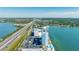 Scenic aerial view of waterfront condo building with pool and boat dock access along the coastline at 7200 Sunshine Skyway S Ln # 4B, St Petersburg, FL 33711