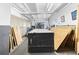 Spacious basement with ample storage space and industrial-style lighting and wooden equipment at 7200 Sunshine Skyway S Ln # 4B, St Petersburg, FL 33711