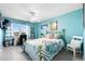 Cozy bedroom with ocean view, desk, and calming blue color scheme at 7200 Sunshine Skyway S Ln # 4B, St Petersburg, FL 33711