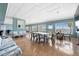 Large clubhouse with dining tables, seating, and water views through large windows at 7200 Sunshine Skyway S Ln # 4B, St Petersburg, FL 33711