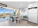 Inviting dining area with built-in bench, views of the outside scenery at 7200 Sunshine Skyway S Ln # 4B, St Petersburg, FL 33711