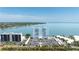 Scenic view of condo building with bay views, pool, and parking at 7200 Sunshine Skyway S Ln # 4B, St Petersburg, FL 33711