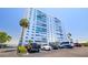 Exterior of building, parking area, and lush landscaping at 7200 Sunshine Skyway S Ln # 4B, St Petersburg, FL 33711