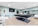 The community game room features a pool table and multiple seating areas for entertainment at 7200 Sunshine Skyway S Ln # 4B, St Petersburg, FL 33711