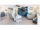 Comfortable living room area with built-in shelving and comfortable seating and neutral decor at 7200 Sunshine Skyway S Ln # 4B, St Petersburg, FL 33711
