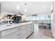 Open concept living and dining area with large windows boasting Gulf views at 7200 Sunshine Skyway S Ln # 4B, St Petersburg, FL 33711