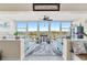 Living room with stunning ocean views, ceiling fan, and neutral colors at 7200 Sunshine Skyway S Ln # 4B, St Petersburg, FL 33711