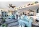 Bright living room with stylish furniture, coastal decor and view into modern kitchen space at 7200 Sunshine Skyway S Ln # 4B, St Petersburg, FL 33711