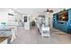 Open-concept living space featuring a modern kitchen, dining area and cozy living room at 7200 Sunshine Skyway S Ln # 4B, St Petersburg, FL 33711