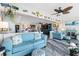 Comfortable living room with bright decor and access to the kitchen and dining area at 7200 Sunshine Skyway S Ln # 4B, St Petersburg, FL 33711