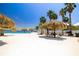 Poolside seating with shade palapas and poolside grills at 7200 Sunshine Skyway S Ln # 4B, St Petersburg, FL 33711