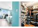 This is a walk-in closet featuring built-in shelving and storage for many items at 7200 Sunshine Skyway S Ln # 4B, St Petersburg, FL 33711