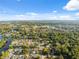 This aerial view shows how lush greenery and long canals run through this neighborhood, offering beautiful views from the homes at 7325 Calder Dr, New Port Richey, FL 34653
