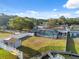 Spacious backyard with a screened pool, shed, fenced yard, and private dock, offering a relaxing outdoor space at 7325 Calder Dr, New Port Richey, FL 34653