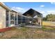 An outdoor carport provides covered parking for a boat, which is conveniently located next to the screened-in patio at 7325 Calder Dr, New Port Richey, FL 34653