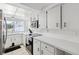 Bright kitchen featuring white cabinetry, stainless steel appliances and a garden window at 7325 Calder Dr, New Port Richey, FL 34653