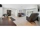 Open-concept living room with access to the pool area, featuring tiled floors and ample seating at 7325 Calder Dr, New Port Richey, FL 34653