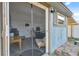 View of the outbuilding, featuring finished interior, small window, and exterior camera at 7325 Calder Dr, New Port Richey, FL 34653