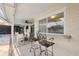 Outdoor patio seating area featuring a pass through to an outdoor bar and summer kitchen at 7325 Calder Dr, New Port Richey, FL 34653