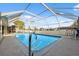 A beautiful screened-in pool with pristine clear water, perfect for relaxation and recreation at 7325 Calder Dr, New Port Richey, FL 34653