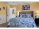Bedroom with a queen bed, beach decor, and view into bonus space at 8497 137Th St, Seminole, FL 33776