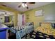 Bright bedroom featuring two beds and ceiling fan at 8497 137Th St, Seminole, FL 33776