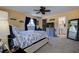 Bright bedroom with a ceiling fan and large window for natural light at 8497 137Th St, Seminole, FL 33776