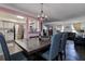 Open-concept dining area featuring a view of the kitchen and living room, ideal for entertaining and everyday living at 8497 137Th St, Seminole, FL 33776