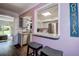 Pass-through window in the kitchen with bar seating that opens up to the dining area, creating an open flow at 8497 137Th St, Seminole, FL 33776