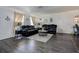Inviting living room featuring a comfortable seating area, dark wood floors, and tasteful decorations at 8497 137Th St, Seminole, FL 33776