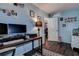 Office featuring wood floors, desk, and view into the dining room at 8497 137Th St, Seminole, FL 33776