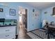 Home office with blue walls, fish tank, and view into bedroom at 8497 137Th St, Seminole, FL 33776