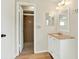 This bathroom features a step-in shower and a vanity with white cabinets and a marble countertop at 8520 Woodall Ct, Tampa, FL 33615