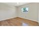 A cozy bedroom with hardwood floors and a sunlit window at 8520 Woodall Ct, Tampa, FL 33615
