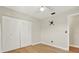 Bedroom with hardwood floors, light walls, and a closet, offering a bright, comfortable space at 8520 Woodall Ct, Tampa, FL 33615