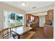 Bright dining nook featuring hardwood floors, granite counters, and a large window at 8520 Woodall Ct, Tampa, FL 33615