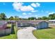 Well-kept gray single-story home with a driveway and green lawn at 8520 Woodall Ct, Tampa, FL 33615