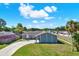 Charming single-story home with a well-maintained lawn and a long driveway on a sunny day at 8520 Woodall Ct, Tampa, FL 33615
