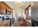 Open kitchen with stainless appliances, granite counters, and a dining nook at 8520 Woodall Ct, Tampa, FL 33615