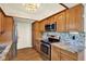Well-equipped kitchen featuring stainless steel appliances and granite countertops at 8520 Woodall Ct, Tampa, FL 33615