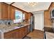 Traditional kitchen featuring stainless steel appliances and granite countertops at 8520 Woodall Ct, Tampa, FL 33615